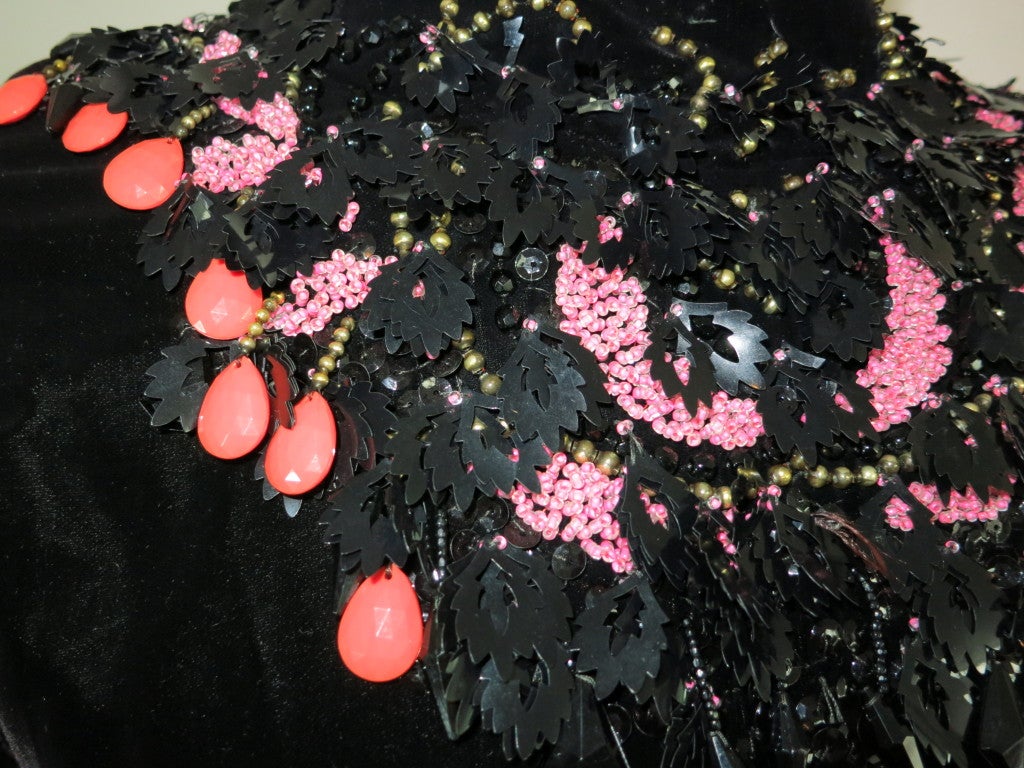 Vintage ARNOLD SCAASI 1960's embellished black velvet dress.  The neckline is comprised of black sequins, and leaf shaped embellishments, with coral tear drops, and brass beads.  Please note that the center back zipper does zip up all the way.  The