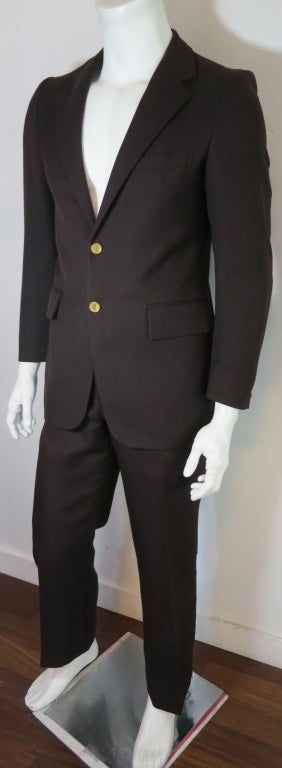 Vintage YVES SAINT LAURENT 1970's Men's dark brown suit.  Gold coin style logo engraved buttons.  Underarm to underarm: 19