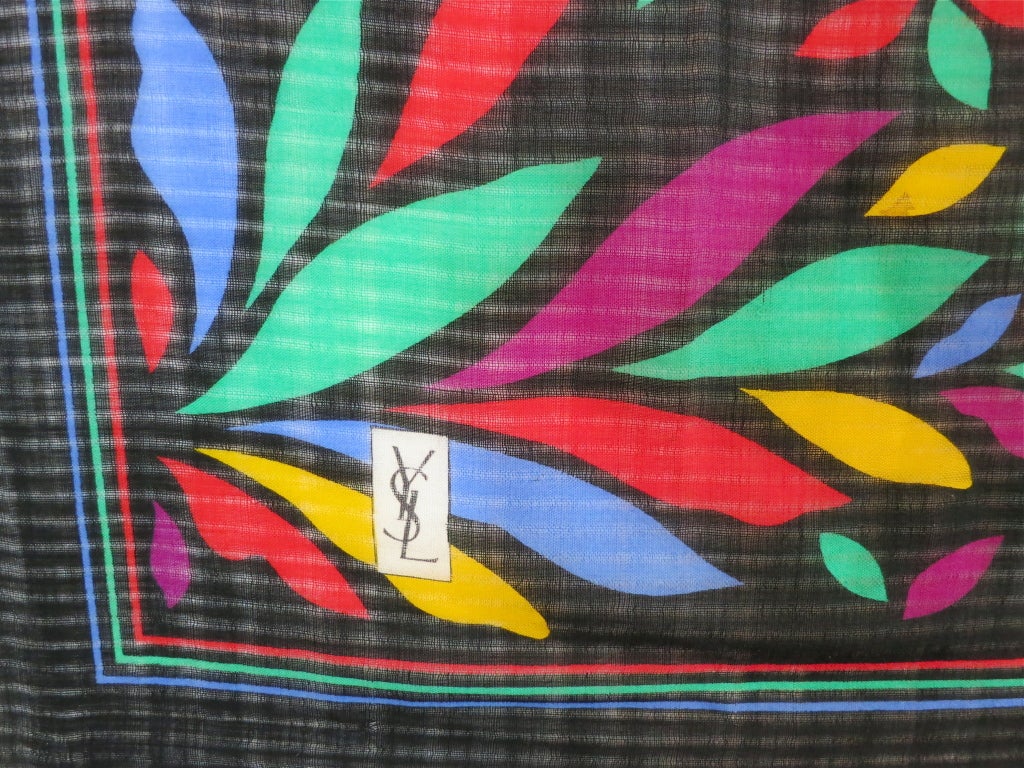 Vintage YSL YVES SAINT LAURENT 1970's era colorful floral foulard scarf.  Sheer wool fabrication with subtle drop shadow stripe effect in the base cloth.  Signature logo at bottom right corner.

38
