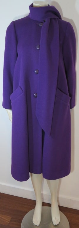 Vintage CHRISTIAN DIOR 1970's era purple scarf coat.  Scarf detail at neck is attached to body and made of the self, wool fabric as body.  Fully lined.

US Label size : 2, mannequin in photos is a US size 6

Underarm to underarm: 19