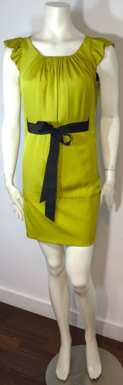 VALENTINO Chartreuse silk charmeuse dress with black grosgrain ribbon waist sash.  Gathered construction at neckline with fluted sleeve cap shape.

Concealed zipper at wearer's side seam.  Satin face of silk at inside

Underarm to underarm: 15
