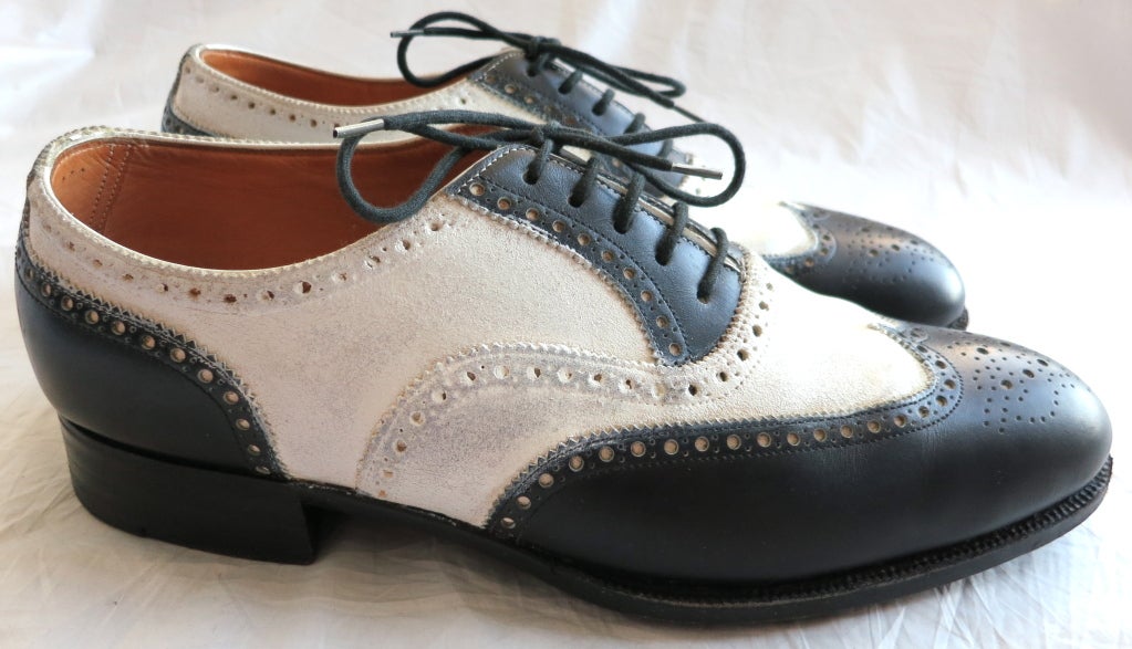 Vintage JOHN LOBB Bespoke black & white spectator dress shoes. The white portion has a coated texture which is true to the original spectator / cricket shoes created by John Lobb in 1868. These shoes were made in the 1980's, but are of exactly the