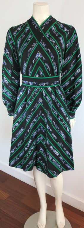 Vintage PAULINE TRIGÉRE mitered floral stripe dress.  Mitered construction at front, sides, and back.  Cross front effect at front chest.  Self fabric belt with hook and eye closures.  Concealed, center back zipper entry.  

Underarm to underarm: