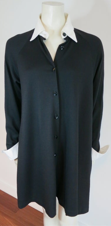 GEOFFREY BEENE Sport black & white trapeze shirt dress with removable collar & cuffs.  Raglan sleeve construction with concealed pockets at sides.  The black base fabric is a wool knit fabric.  The collar and cuffs are removable by way of buttons. 