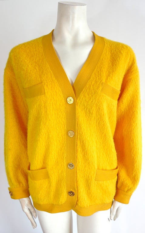 Vintage NINA RICCI 1970's golden yellow wool & alpaca jacket.  Trapunto stitch detailing at border trim details.  Engraved golden finish metal button closures.  Dual waist and chest pockets. 

Underarm to underarm: 20-1/2