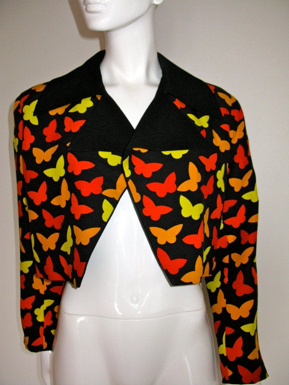 Vintage GALANOS 1980's era butterfly printed wool jacket.  Cropped, open front style with solid black lapels.

Underarm to underarm: 40