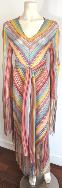 MISSONI Mitered rainbow knit stripe 3pc. fringed ensemble, pants, sash, and overdress.  The fabric is a semi sheer knit with elongated rainbow color fringe trim on the overdress and sash.  

Overdress: Underarm to underarm: 18