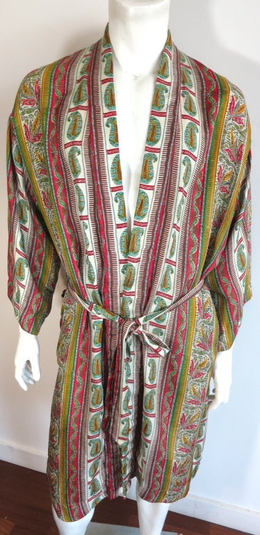 Vintage TURNBULL & ASSER 1960's paisley and cannabis leaf artwork printed men's silk robe with matching sash.  Broad stripe panels with detailed, linear paisley and leaf printed motifs.  Golden yellow, red, and green atop ivory base.  Luxurious silk