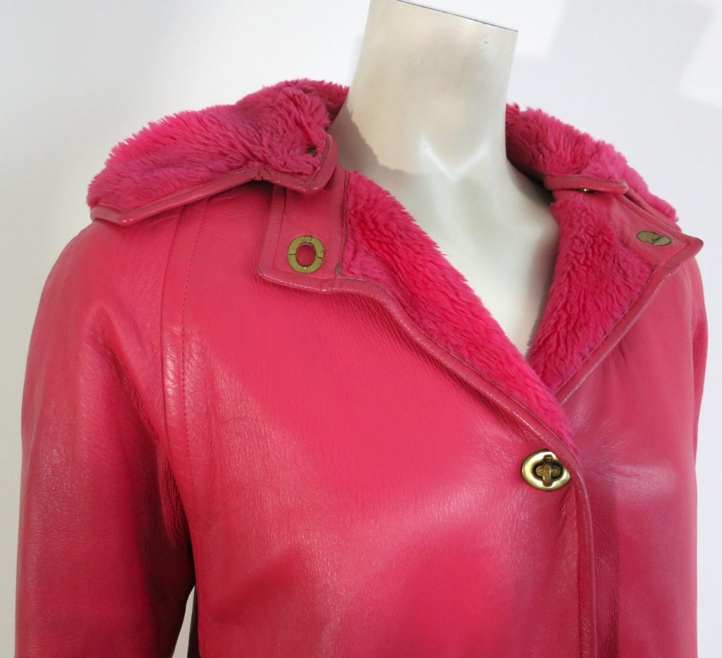 Vintage BONNIE CASHIN / SILLS 1960's bright pink angola leather coat with faux fur lining, and detachable hood.  Signature brass metal turn lock hardware closures at front and detachable hood neckband.  Wrap around style side pockets.  This 1960's