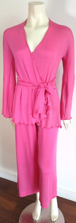 Vintage STEPHEN BURROWS 1970's 3pc. shimmering pink, signature lettuce hem construction ensemble.  This excellent condition ensemble includes wrap style jacket, flare leg pants, and matching waist sash.  The knit jersey fabrication has a shimmering,