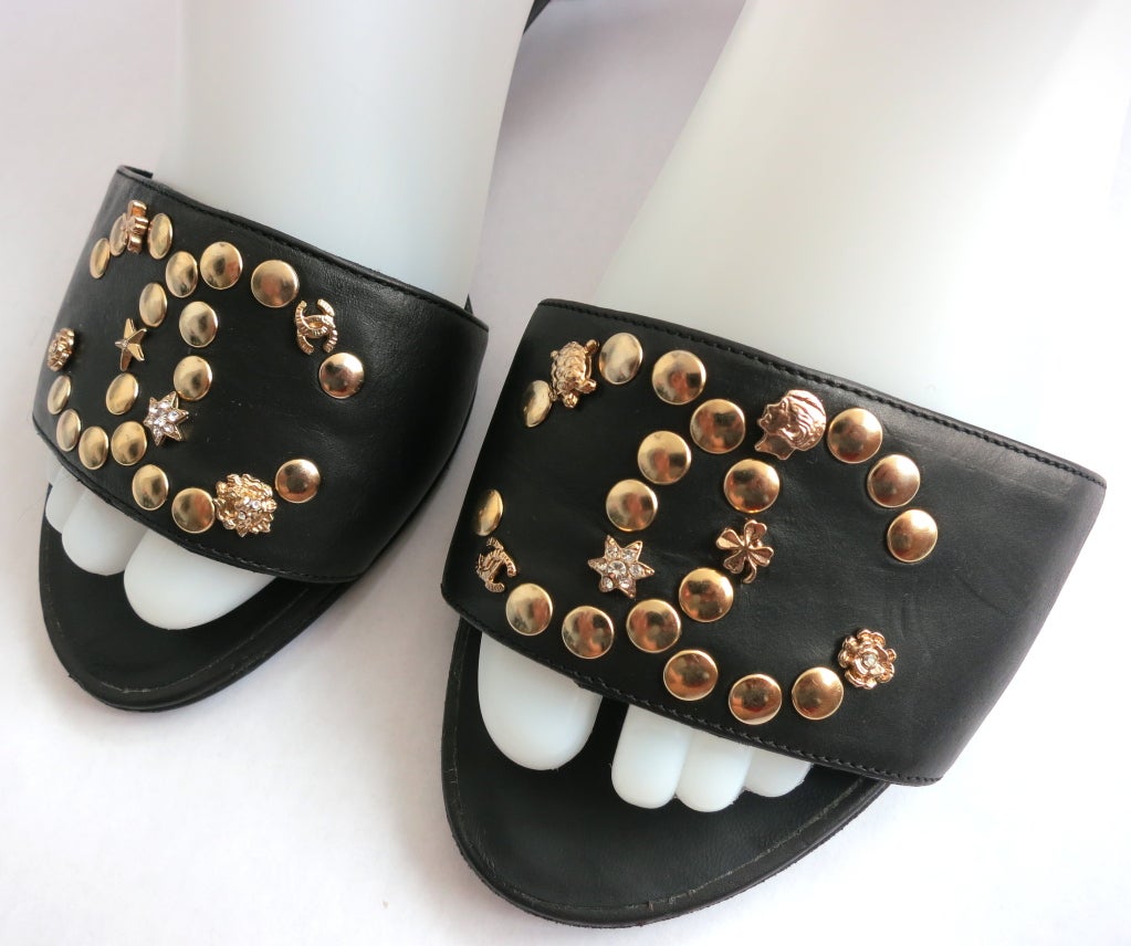 Women's CHANEL PARIS Black leather nail head logo kitten heel sandals