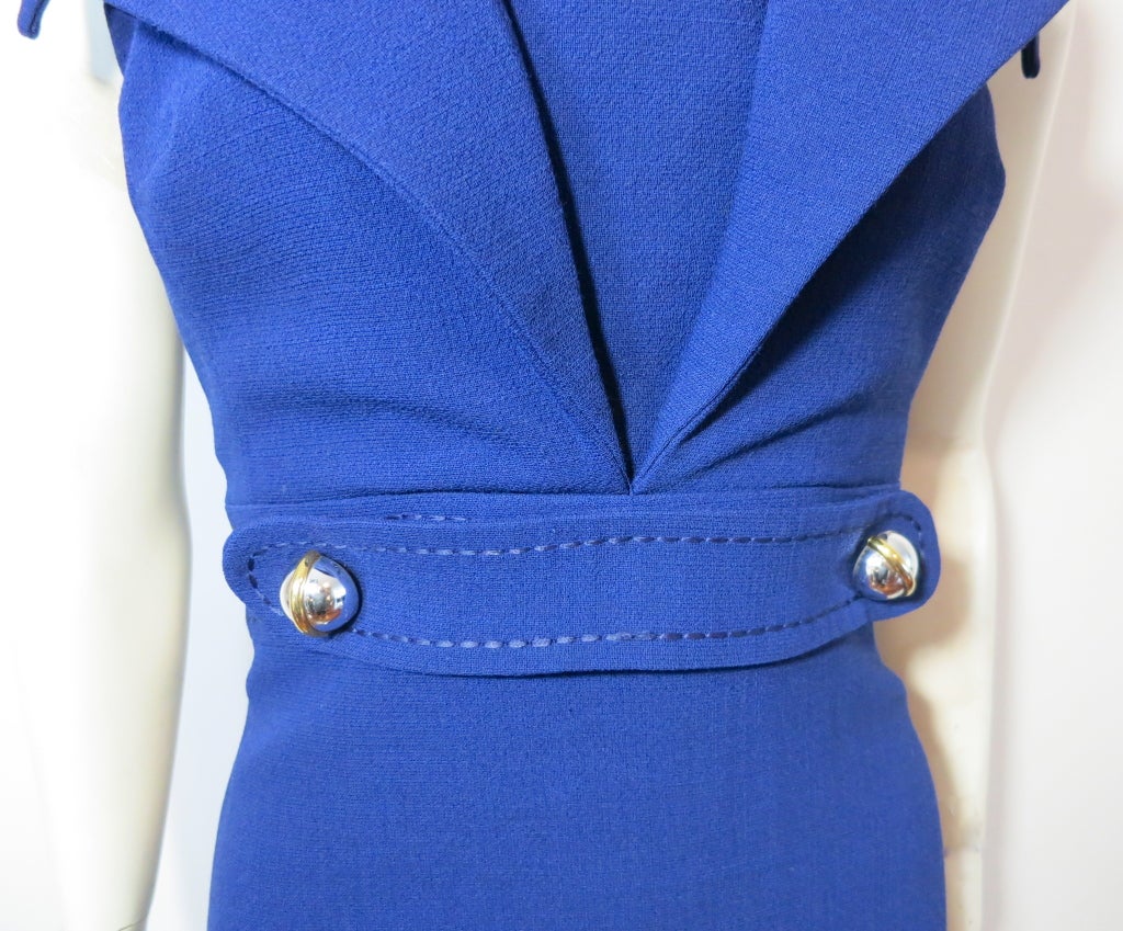 Vintage GEOFFREY BEENE late 1960's ultramarine lapel dress with oversized, polished dome metal hardware front belt detailing.  This gorgeous dress features an internal elasticated halter neck strap for support.  Fully lined, and in excellent