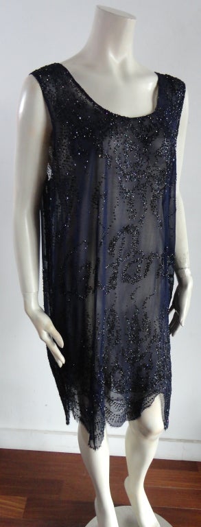 JEAN PAUL GAULTIER 'Jai Paris 1920 fin-de-siècle' aubergine glitter dress in sheer mesh with tonal, glitter style artwork printing.  Art deco style motifs at top and bottom scalloped hemline.  Double layered with nude tone inside mesh slip dress. 