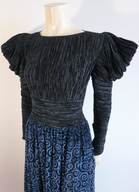 Vintage MARY MCFADDEN 1980's era signature 'Marii' pleated dress.  Balloon style draped sleeves with a fitted waistband construction.  The bottom skirt is made of a plush velvet burnout in a lovely swirl artwork with sparkly Lurex outlines.  Center