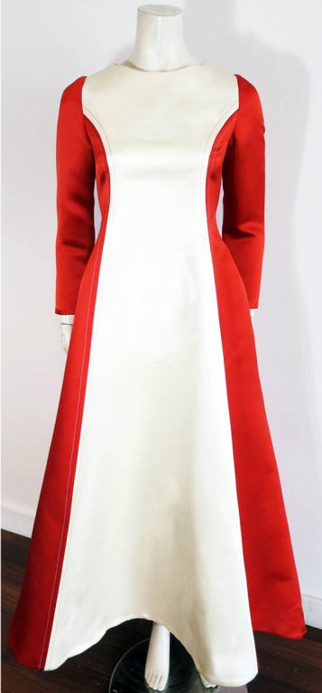 Vintage BILL BLASS 1970's Duchess silk satin gown. The gown has an amazing shape, and is constructed with exceptional craftsmanship.  Pearlescent ivory silk front panel with rich red satin sides and back. Long sleeve, fitted bodice with voluminous,