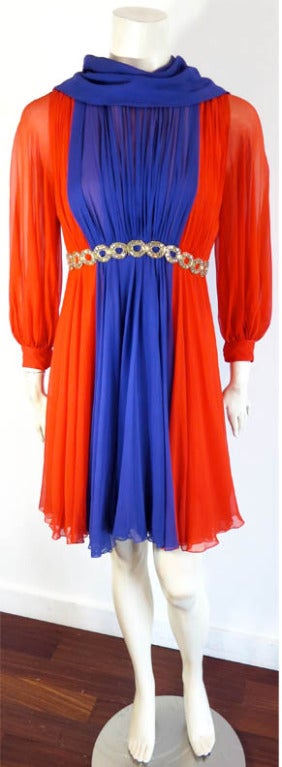 Gorgeous, vintage SARMI 1960's color blocked design, silk chiffon dress.  The dress is the same design (in a shorter length) as the Sarmi dress that was part of Lena Horne's estate auction in 2011.  Orange silk chiffon with center panel and attached