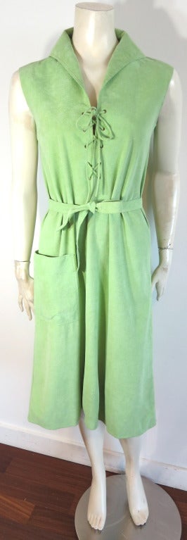 Vintage HALSTON 1970's Light green, plush ultra suede dress with lace front tie closure.  Brass metal eyelets at front V-neck placket with self fabric lace tie.  Detachable waist sash.  Patch pocket detail at wearer's right side waist.  'A-line'