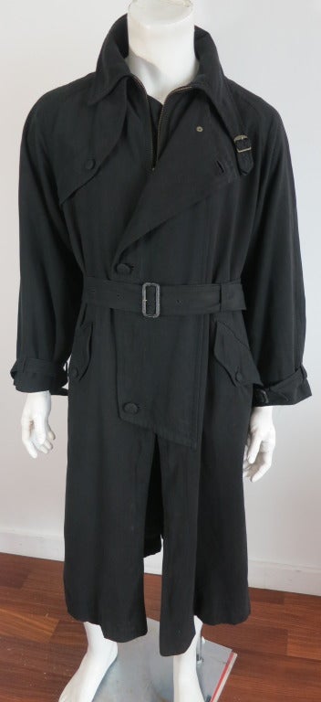 Vintage MATSUDA Japan light black ultra-suede trench coat.  The full length trench coat features an oversized storm placket front with button through construction, and zipper entry beneath.    The coat also features a full length metal zipper at the