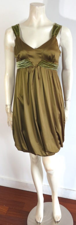 JOHN GALLIANO Olive satin & velvet bubble hem dress.  Gathered silk velvet, empire waist construction with 'V' shaped front, inset paneling.  Concealed side seam zipper entry.  Elasticated hem for a volume, 'bubble' style silhouette.  Stretch