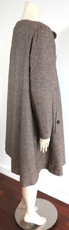 GEOFFREY BEENE Early 1990's wool tweed dress in dark brown, light beige.  Triple button front neck placket with dual waist level button through pockets.

Dramatic A-line silhouette.  Fully lined in satin with lace bottom hem trim.  

Made in the