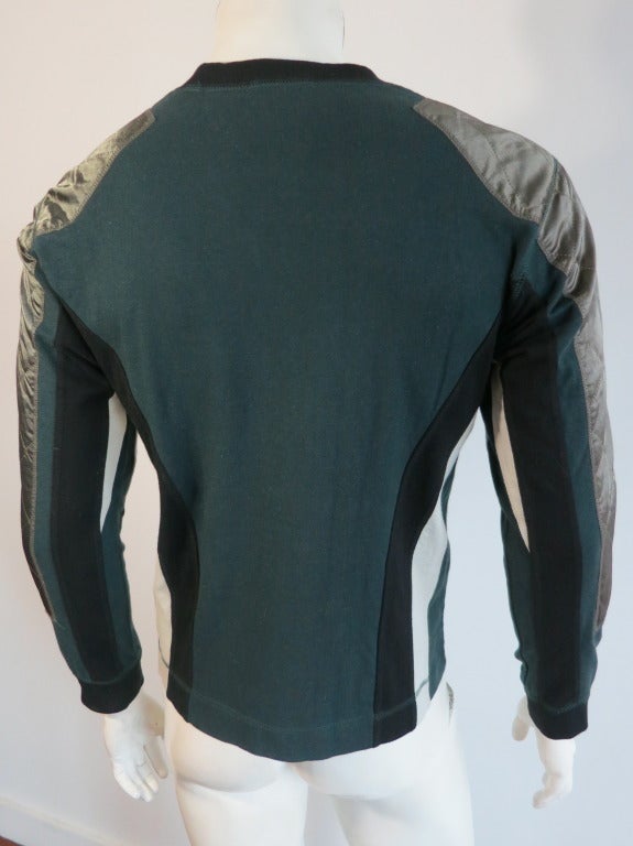 ISSEY MIYAKE 1990's Men's satin color blocked jumper.  Diamond quilted, satin applique panels at side sleeves and shoulder.  Inset paneling at sides and underarms. Stretch fleece base fabrication with knit rib collar and cuffs.  Overcast stitch seam