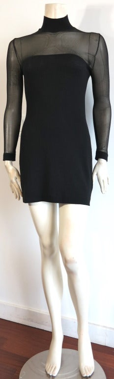 JEAN-PAUL GAULTIER 'Too fast to live too young to die' knit body conscious dress.

Sheer knit netting above front chest, sleeves, and back panel with velvet flocked artwork.

Signature locker loop detail at rear neck.

*Measurements*
Please