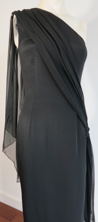 Vintage CHRISTIAN DIOR CD Robes Du Soir black cascade dress.

100% Silk fabrication with chiffon cascading detail at back and wearer's left hip.  One shoulder style evening dress with curved up, side hem.  Concealed size seam zipper entry with