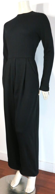 Vintage GEOFFREY BEENE Black knit jumpsuit with concealed center back zipper entry, and zipper detail sleeves

Single pleat front with side, waist level pockets

Fly front stitching detail

Fully lined

Made in the USA, as labeled

In