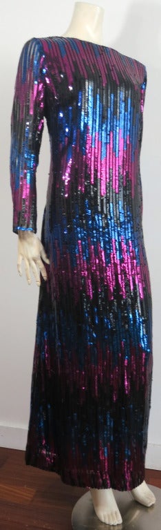 Vintage BONWIT TELLER 1970's Tonic sequin column dress in deep blue and purple.

Long sleeves with concealed center back zipper entry,

Fully lined.

Made in the USA, as labeled.

**Measurements**

Flat underarm to underarm: 20-1/2