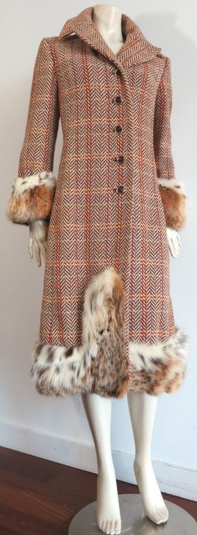 Vintage CHRISTIAN DIOR Lynx fur trimmed wool tweed midi-coat from Fall/Winter 1970.  The same style coat was featured in the August 1970 issue of Harper's Bazzar magazine, as shown in image #3 of the photo section.

Ultra-soft, genuine lynx fur at