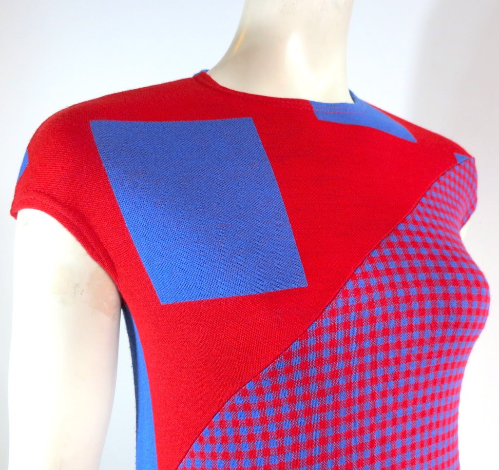 Vintage RUDI GERNREICH 1970's unworn, knit pique gingham geometric dress in vibrant red and blue.  

The dress features bias angled, insert panel seaming at the front and back.

The main dress features large-scale, knit rectangular geometric