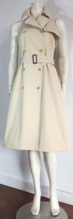 BURBERRY LONDON Trench halter-neck dress.

This amazing dress is constructed using the same tailoring methods for a signature Burberry trench coat, but features sexy cut-out shoulders, and an open back detail.

Signature trench flap detail at
