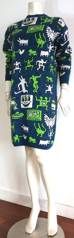 New KEITH HARING FOUNDATION '84 Artwork sweater knit dress.

This new sweater dress features signature Keith Haring '84 artwork in dark blue ground with multi-color artwork motifs.

Loose/volume fit silhouette.

Solid ribbed neckline, cuffs,