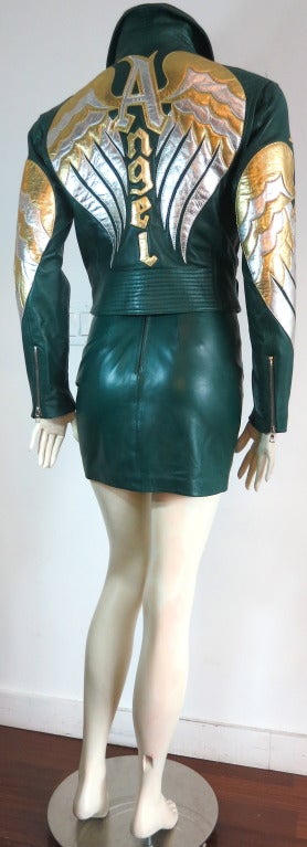 NORTH BEACH LEATHER 'Angel' 2pc. jacket & skirt set.  

Worn once, and in mint/'like new' condition.

This amazing jacket & skirt set features a dark forest green, soft leather base hyde with metallic silver and gold leather 'Angel' wing