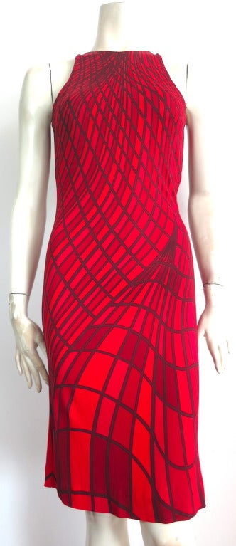 Unworn ROBERTA DI CAMERINO Geometric printed knit dress.

This amazing knit dress features an engineered geometric artwork print that fans out towards the bottom hem.  Multi-shades of red used in the print artwork, scarlet, crimson,