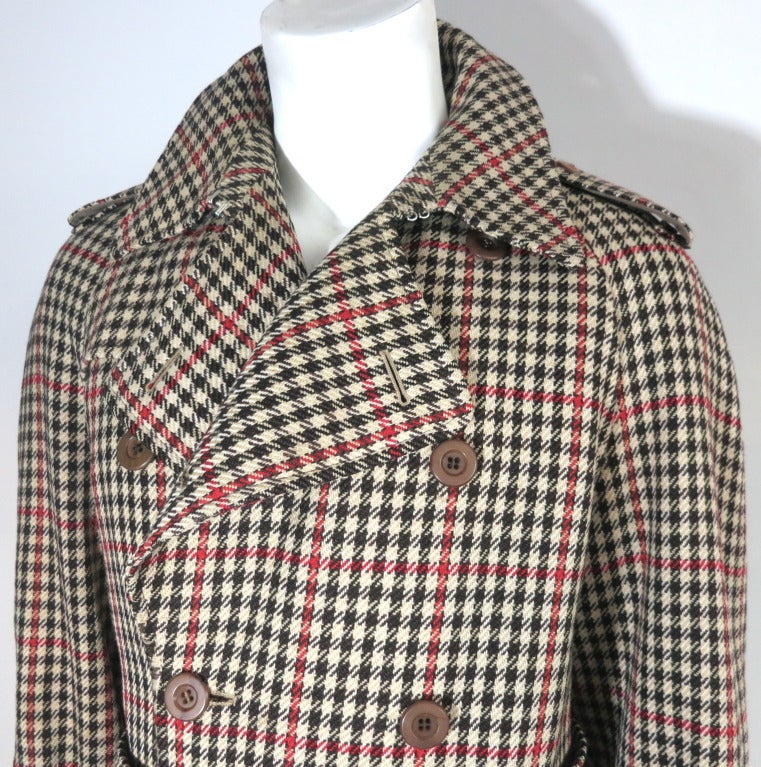 Vintage THE TURNBULL & ASSER LONDON wool houndstooth check coat.

This handsome coat and matching belt was purchased from Bonwit Teller in the late 1950's to early 1960's.

The coat has a traditional double-breasted, trench coat silhouette, and