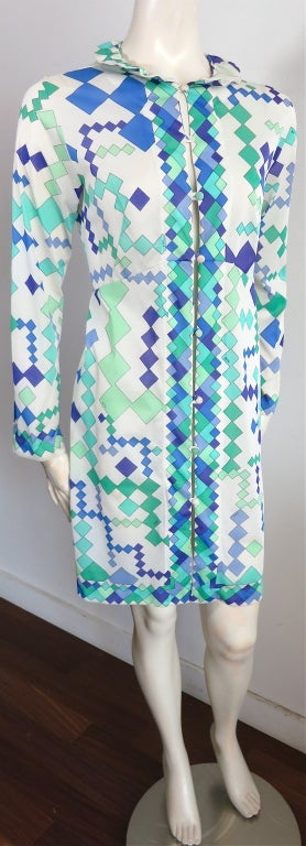 Vintage EMILIO PUCCI Late 1960's Formfit Rogers button front dress with ruffle detail neck.  Engineered patterning at the front placket and hem.  Ivory base with Spearmint, jade, and cobalt blue geometric printing. The fabric is semi sheer