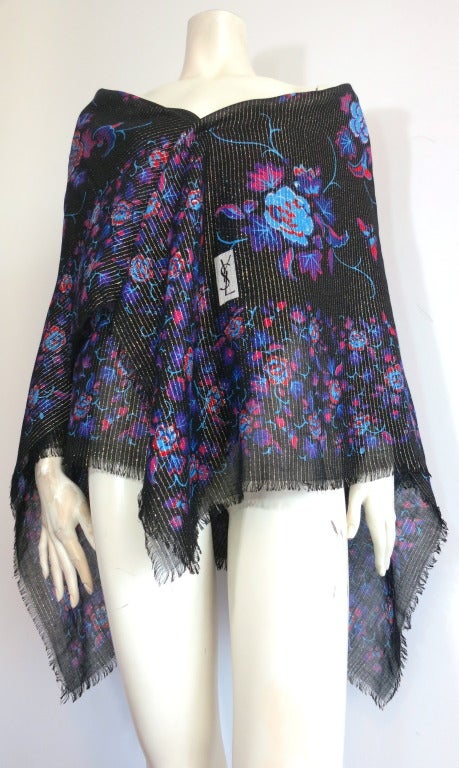 Huge, vintage YVES SAINT LAURENT Scarf / wrap.

This gorgeous scarf was designed by Yves Saint Laurent in the late 1970's.

The scarf features multi-color floral print with matching floral and butterfly border.  YSL box logo is prominently