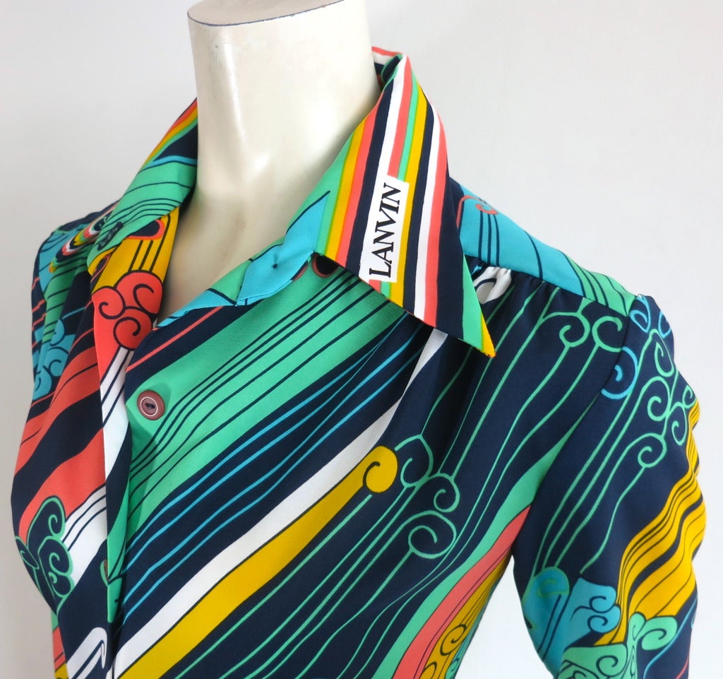 Vintage LANVIN Colorful printed shirt dress.

The dress was designed by the house of Lanvin during the late 1960's to the early 1970's.

This great condition shirt dress features colorful, bias-style swirl stripes with signature 'Lanvin' logo