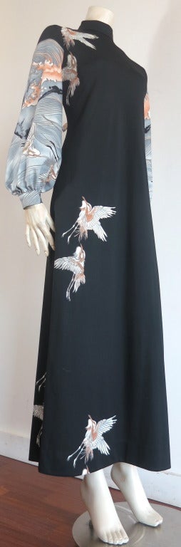Stunning MALCOLM STARR Rizkallah engineered print dress.

Excellent condition stretch tricot dress featuring asian style bird and ocean wave print.

Solid black body with white & gray bird motif artwork along the length of the wearer's right