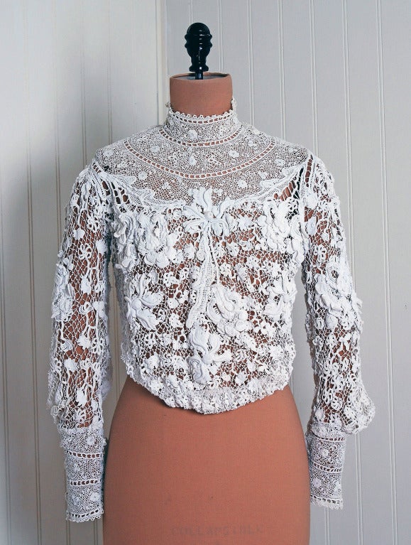 Beautiful crisp-white long billow-sleeved handmade Irish crochet-lace blouse from the Victorian era. The distinguishing element of Irish crochet lace is breathtaking three-dimensional raised work. This blouse has all the attributes favored by