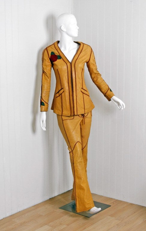 Spectacular late 1960's North Beach Leather set entirely hand-crafted with butter-soft leather. The jacket is meticulous detailed with ruby-red suede roses that accent the right-bodice,cuffs and backside. I love the side-pockets and hourglass