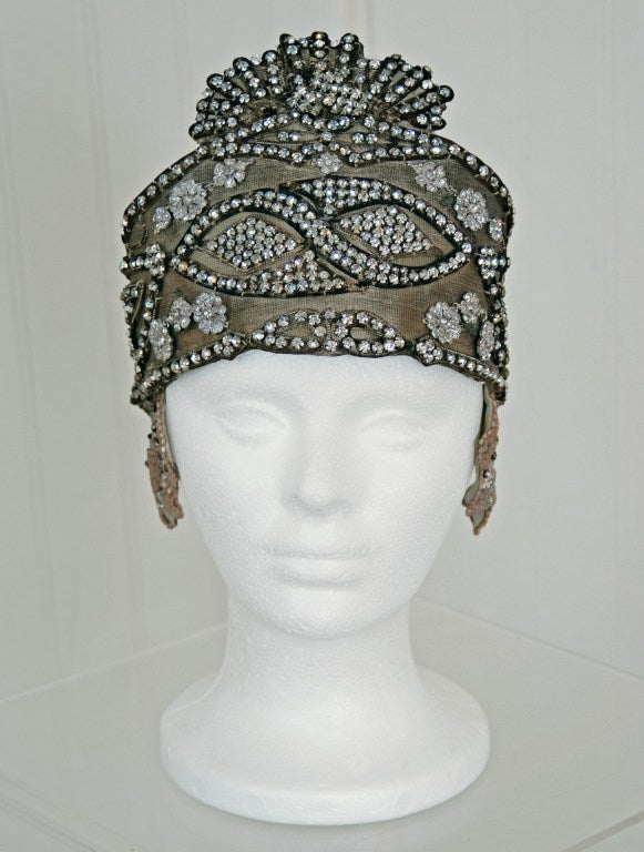 Breathtaking 1920's metallic-gold lame flapper evening headpiece. This is, without a doubt, the most extraordinary antique headpiece I have ever laid eyes on. Prong-studded with tons of sparkling rhinestones in the most amazing art-deco design. Worn