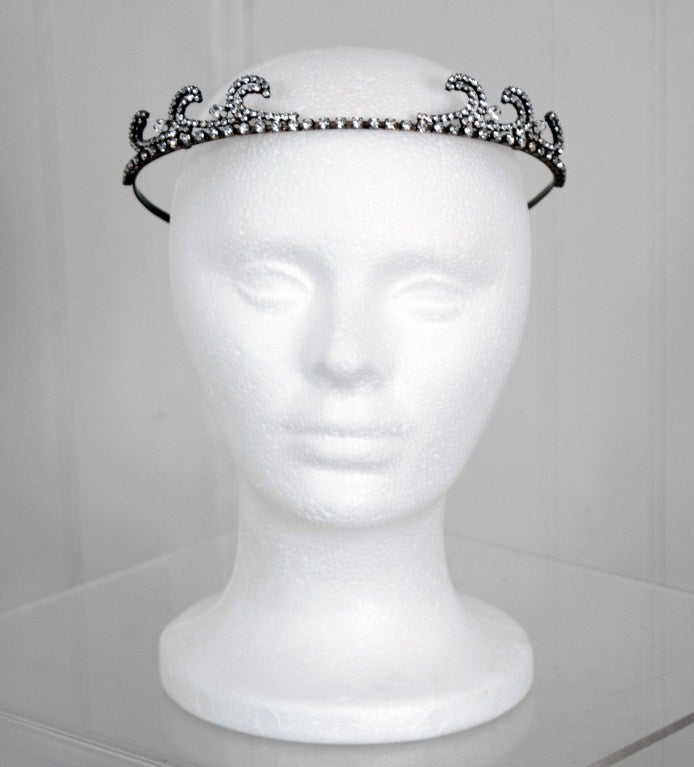 Regal and unique rhinestone and brass-colored metal tiara from the mid 1920's. These pieces were very popular in their time and where the crowning jewel for any flapper. I love the art-deco scalloped design and it can fit a range of head sizes. No