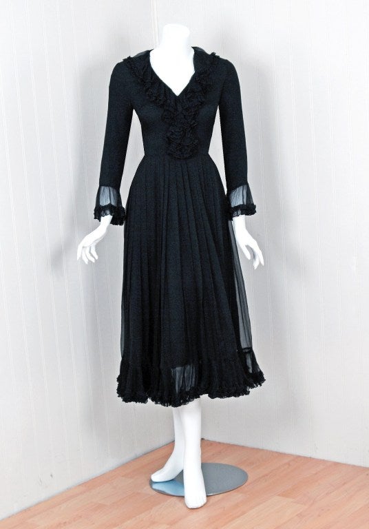 Christian Dior is probably the best known name in high fashion since the late 1940's. This breathtaking 1970's numbered Christian Dior piece is a perfect example of why this couture house has stood the test of time. Made of black silk-chiffon; it