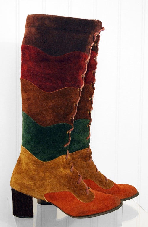 Sensational 1960's colorful rainbow-stripe boots in the most amazing style! I love the lace-up ties and wooden-heel. Many modern shoes are a complete re-interpretation of this iconic design but this pair is the real deal! Boots like these will leave