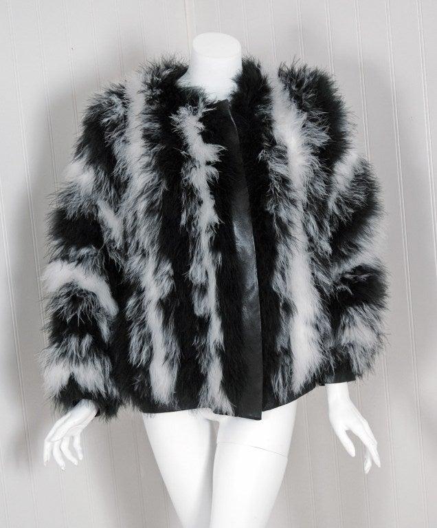 Breathtaking black & white striped marabout-feather jacket from the infamous Rive Gauche collection during the mid-1970's.
Pieces from this decade are very rare and are true examples of fashion history. I adore the playful use of feathers and the