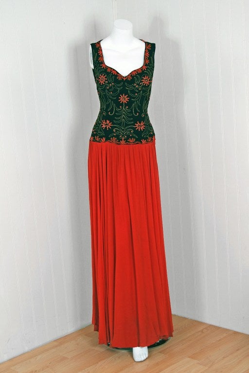 Alluring early labeled 1940's Ceil Chapman evening dress in the most stunning black and coral-orange color combination! The metallic gold-lame soutache adds a perfect amount of sparkle to this seductive treasure. This unique deco beadwork &