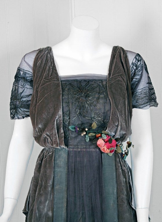 Breathtaking 1910's museum-quality metallic silver-lame & dove-gray silk velvet evening tea-gown. The ethereal color palette touches a deep chord in our collective aesthetic consciousness. As fashion lovers, we never tire from antique metallics;