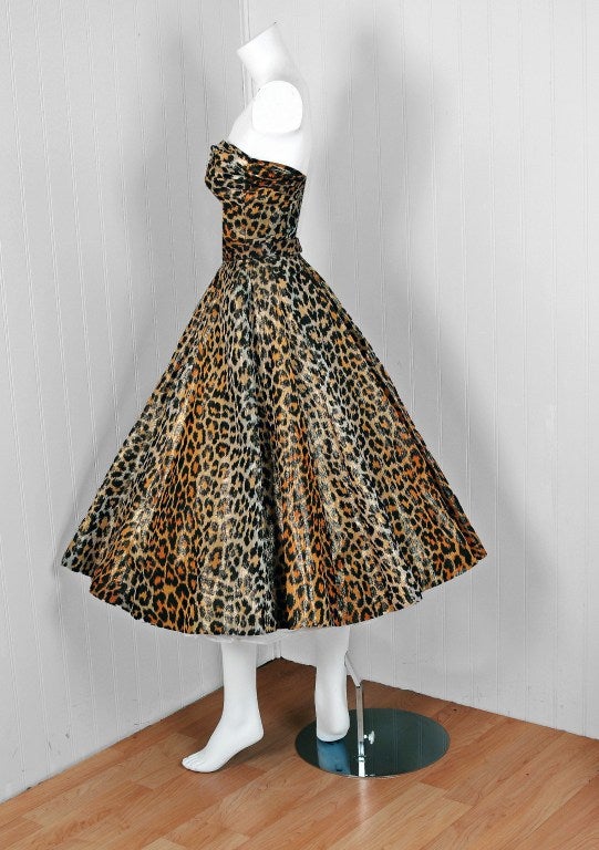 Nettie Rosenstein garments are very hard to come by and this stunning early 1950's light-weight metallic leopard-print silk party dress is a perfect example of her genius. I love the slightly ruched low-cut plunge boned strapless bodice. The